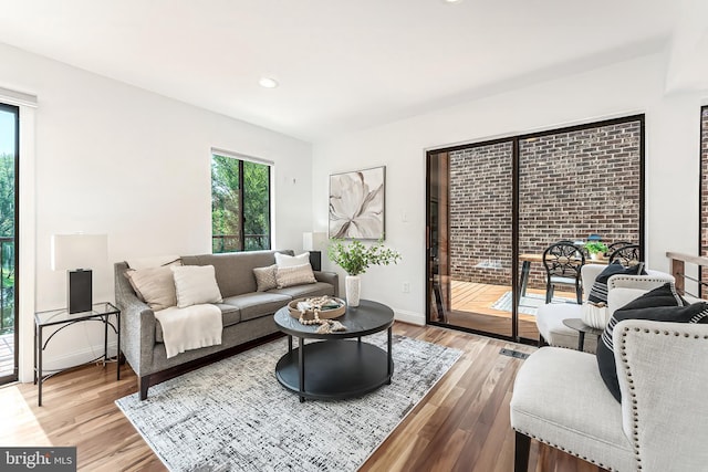 2127 Cabots Point Ln, Reston, VA 20191 - living room featuring wood finished floors and recessed lighting
