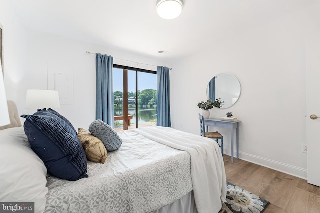 2127 Cabots Point Ln, Reston, VA 20191 - bedroom featuring wood finished floors and a water view