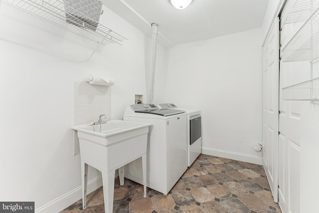 2127 Cabots Point Ln, Reston, VA 20191 - laundry room featuring separate washer and dryer and baseboards