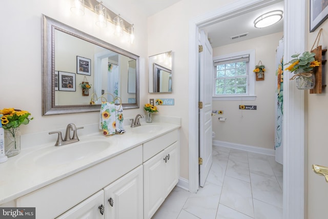 11 Harvest Dr, Pittsgrove, NJ 08318 - full bathroom with marble finish floors, double vanity, toilet, and baseboards