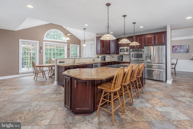 11 Harvest Dr, Pittsgrove, NJ 08318 - kitchen featuring stainless steel appliances, a sink, a peninsula, light stone countertops, and a kitchen island