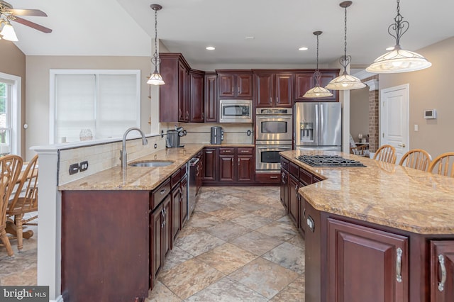 11 Harvest Dr, Pittsgrove, NJ 08318 - kitchen with appliances with stainless steel finishes, a sink, tasteful backsplash, ceiling fan, and a center island