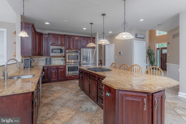 11 Harvest Dr, Pittsgrove, NJ 08318 - kitchen featuring stainless steel appliances, a sink, reddish brown cabinets, recessed lighting, and light stone counters