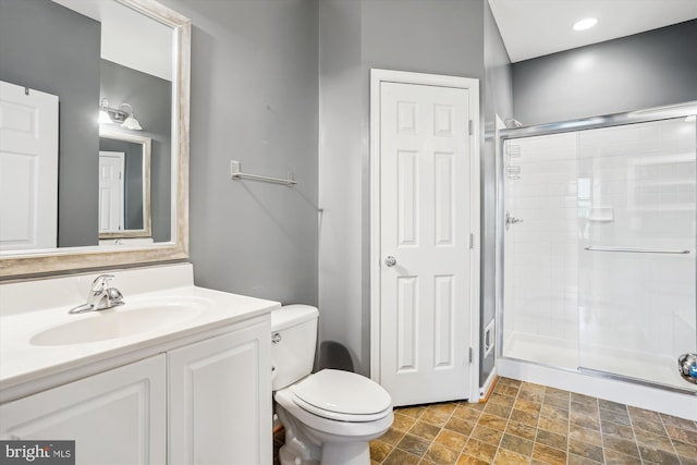 16758 Blackjack Oak Ln, Woodbridge, VA 22191 - bathroom with a stall shower, vanity, toilet, and stone finish floors