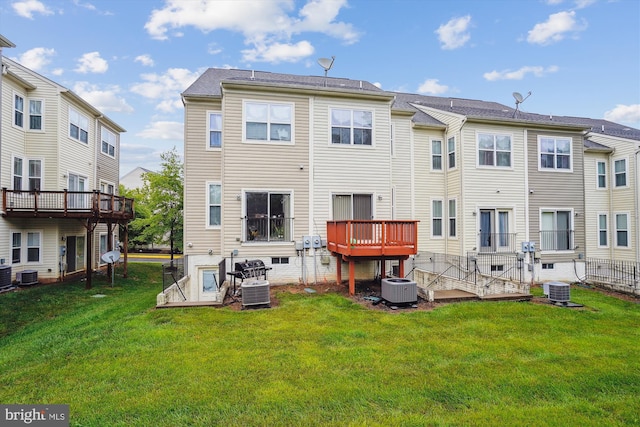 16758 Blackjack Oak Ln, Woodbridge, VA 22191 - back of property with central air condition unit, a lawn, and a wooden deck
