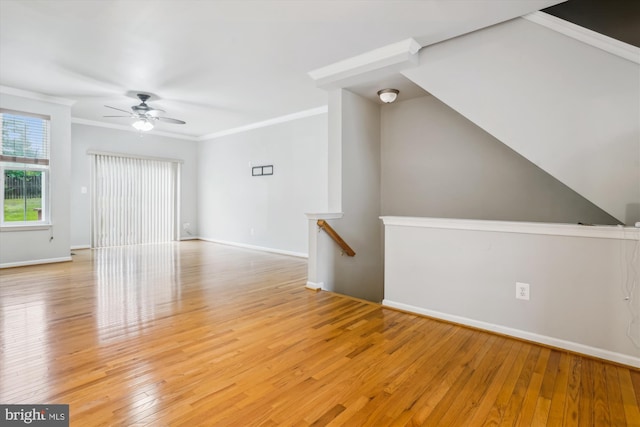 16758 Blackjack Oak Ln, Woodbridge, VA 22191 - unfurnished living room with a ceiling fan, light wood-style flooring, baseboards, and ornamental molding