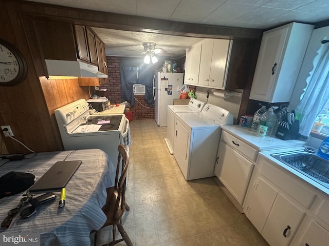 65 Rachel Ln, Inwood, WV 25428 - kitchen featuring freestanding refrigerator, washing machine and dryer, under cabinet range hood, ceiling fan, and light countertops