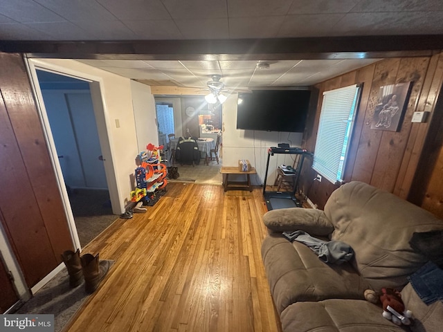 65 Rachel Ln, Inwood, WV 25428 - living area featuring wood finished floors, a ceiling fan, and wooden walls