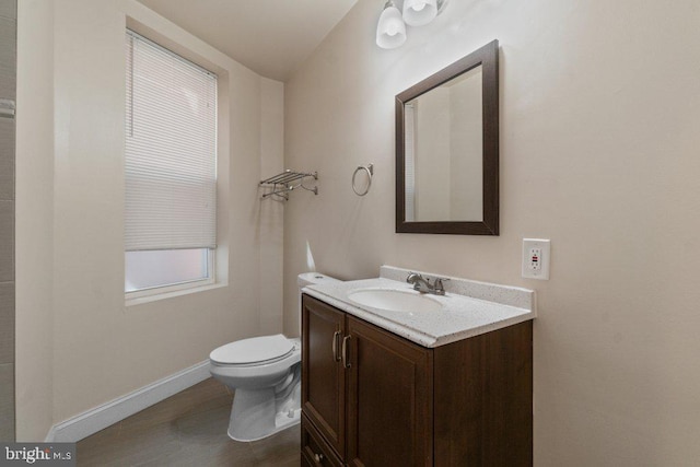 2740 Saint Paul St, Baltimore, MD 21218 - bathroom with vanity, toilet, and baseboards