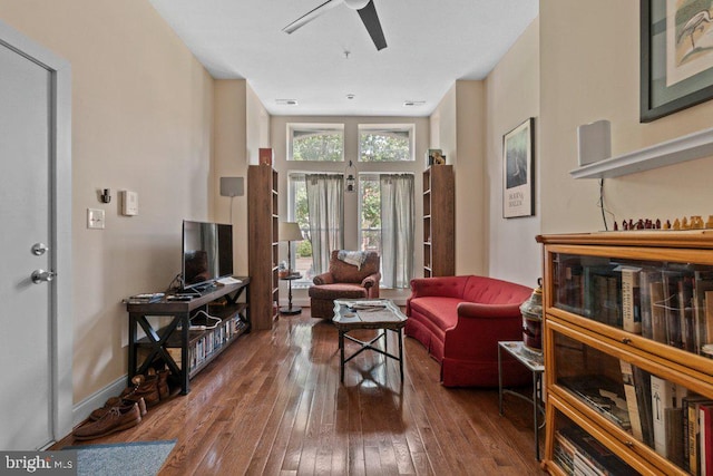2740 Saint Paul St, Baltimore, MD 21218 - living room with a ceiling fan, wood-type flooring, and baseboards