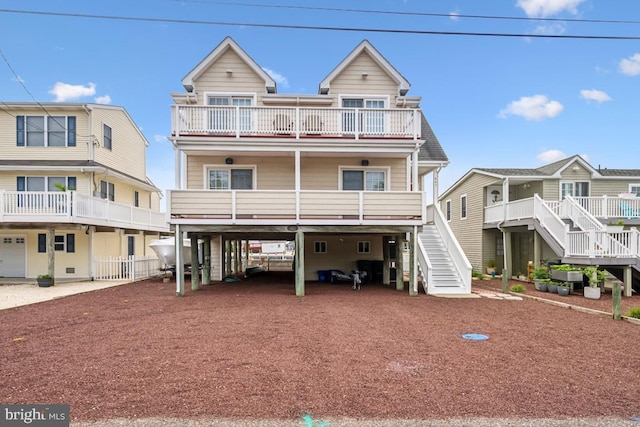 461 Anchor Rd, Tuckerton, NJ 08087 - view of front of house featuring a carport, a balcony, stairway, and driveway