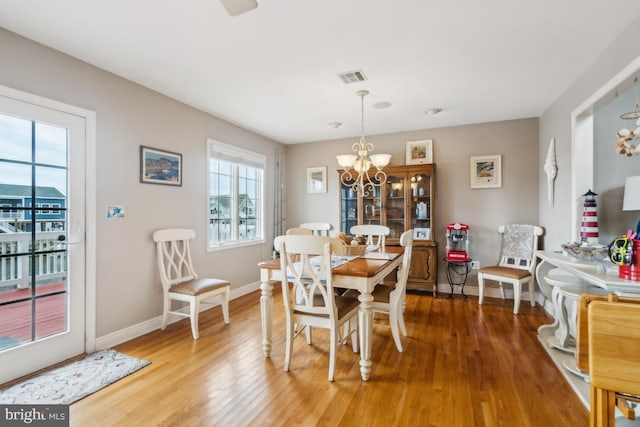 461 Anchor Rd, Tuckerton, NJ 08087 - dining space featuring light wood-type flooring, a chandelier, and baseboards