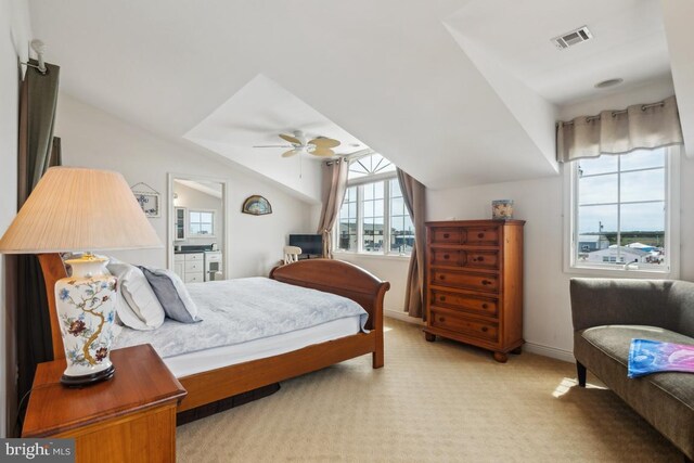461 Anchor Rd, Tuckerton, NJ 08087 - bedroom featuring light colored carpet, baseboards, vaulted ceiling, connected bathroom, and ceiling fan