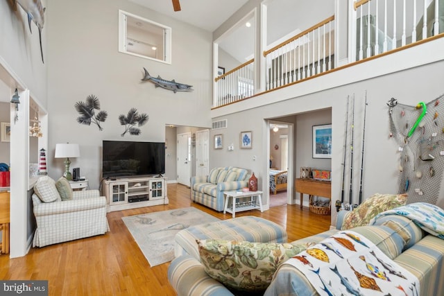 461 Anchor Rd, Tuckerton, NJ 08087 - living room with a high ceiling, wood finished floors, ceiling fan, and baseboards