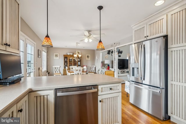 461 Anchor Rd, Tuckerton, NJ 08087 - kitchen featuring stainless steel appliances, cream cabinets, a peninsula, a ceiling fan, and light countertops