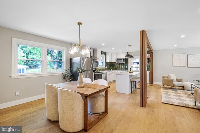 12300 La Plata St, Silver Spring, MD 20904 - dining space featuring baseboards, light wood finished floors, and recessed lighting