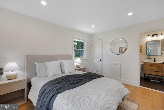12300 La Plata St, Silver Spring, MD 20904 - bedroom featuring light wood-style flooring, recessed lighting, baseboards, and ensuite bath
