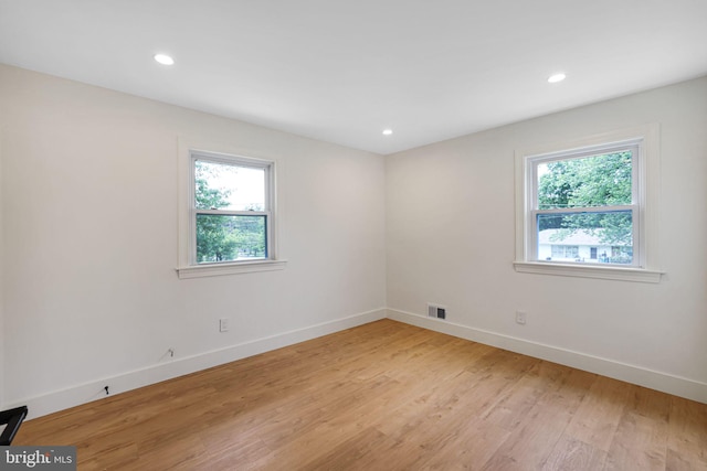 12300 La Plata St, Silver Spring, MD 20904 - spare room featuring healthy amount of natural light, light wood-type flooring, baseboards, and recessed lighting