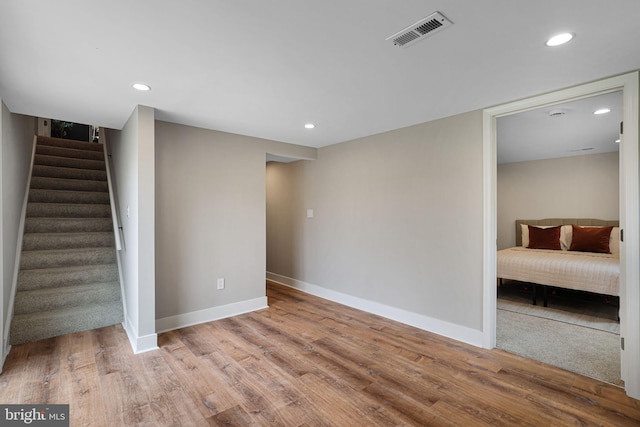 12300 La Plata St, Silver Spring, MD 20904 - basement with baseboards, stairway, wood finished floors, and recessed lighting