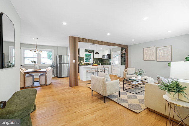 12300 La Plata St, Silver Spring, MD 20904 - living area featuring light wood-type flooring, a chandelier, and recessed lighting