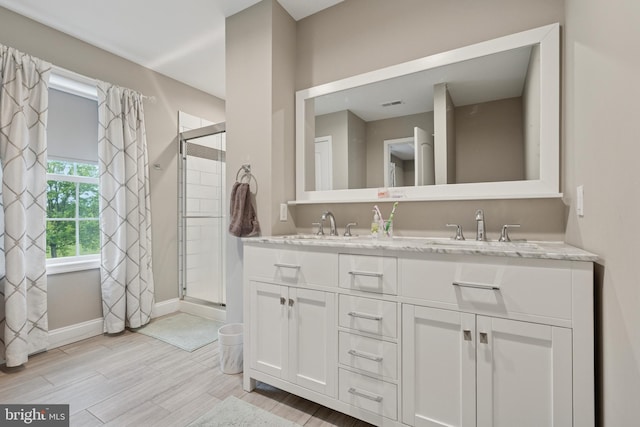 120 Northturn Ln, Levittown, PA 19054 - full bath featuring a shower stall, double vanity, wood finished floors, and baseboards