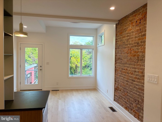 252 Sumac St, Philadelphia, PA 19128 - unfurnished dining area with light wood-style flooring, brick wall, baseboards, and recessed lighting