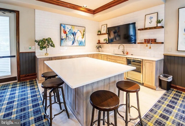 12925 Centre Park Cir Unit 106, Herndon, VA 20171 - bar featuring a sink, ornamental molding, wainscoting, beverage cooler, and plenty of natural light