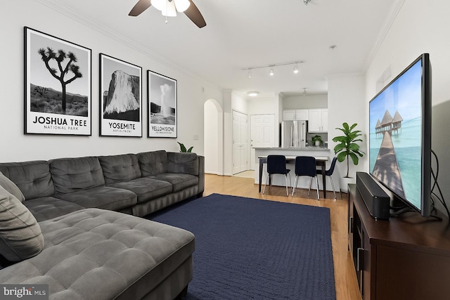 12925 Centre Park Cir Unit 106, Herndon, VA 20171 - living room featuring light wood-type flooring, a ceiling fan, arched walkways, track lighting, and ornamental molding