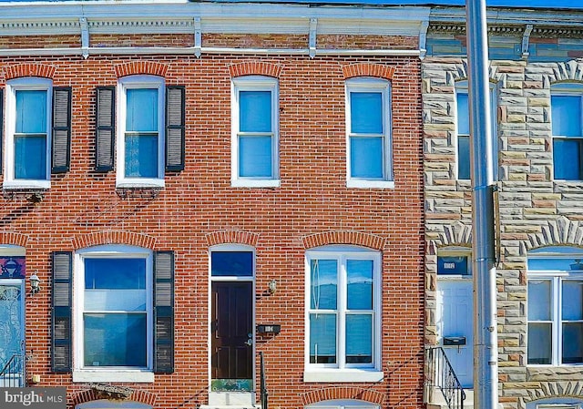 1114 W Cross St, Baltimore, MD 21230 - townhome / multi-family property with brick siding and stone siding