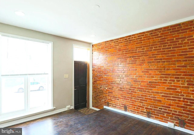 1114 W Cross St, Baltimore, MD 21230 - spare room featuring brick wall, dark wood-style flooring, healthy amount of natural light, and recessed lighting