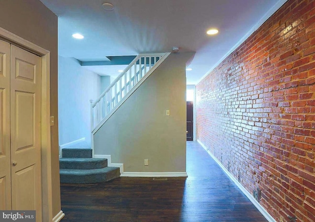 1114 W Cross St, Baltimore, MD 21230 - staircase with wood finished floors, brick wall, and recessed lighting