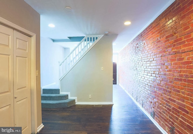 1114 W Cross St, Baltimore, MD 21230 - hallway with stairs, brick wall, wood finished floors, and recessed lighting