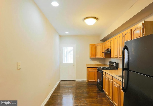 1114 W Cross St, Baltimore, MD 21230 - kitchen with black appliances, under cabinet range hood, light countertops, dark wood-type flooring, and recessed lighting