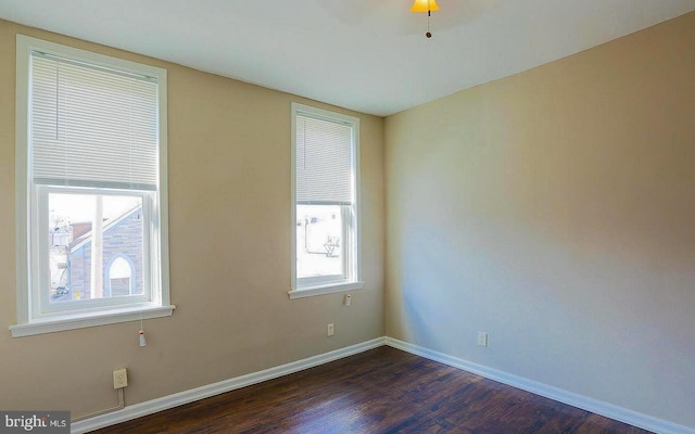 1114 W Cross St, Baltimore, MD 21230 - empty room with dark wood-type flooring and baseboards