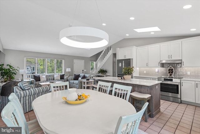 917 Lake View Dr, Bethany Beach, DE 19930 - dining area featuring lofted ceiling, a skylight, recessed lighting, and light tile patterned floors