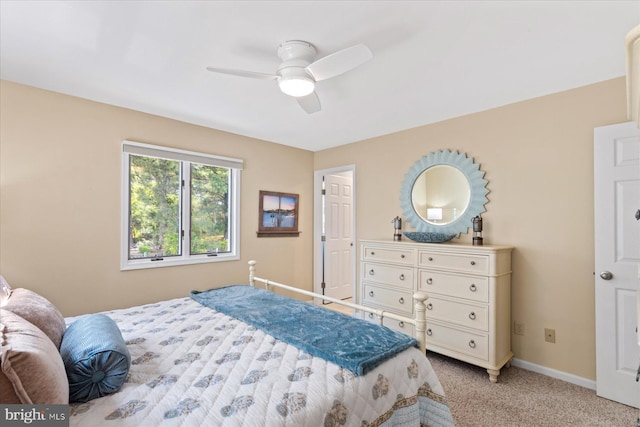 917 Lake View Dr, Bethany Beach, DE 19930 - bedroom with light carpet, baseboards, and ceiling fan