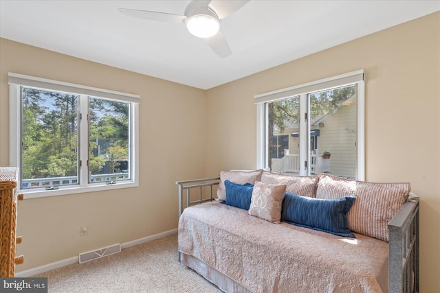 917 Lake View Dr, Bethany Beach, DE 19930 - bedroom featuring multiple windows, carpet floors, baseboards, and a ceiling fan
