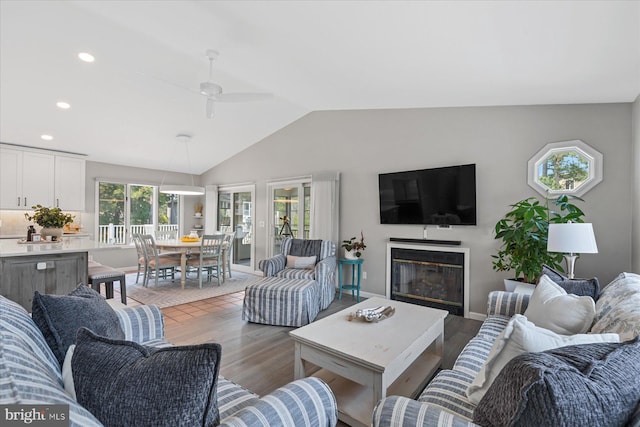 917 Lake View Dr, Bethany Beach, DE 19930 - living room with light wood-style floors, vaulted ceiling, a ceiling fan, a glass covered fireplace, and recessed lighting