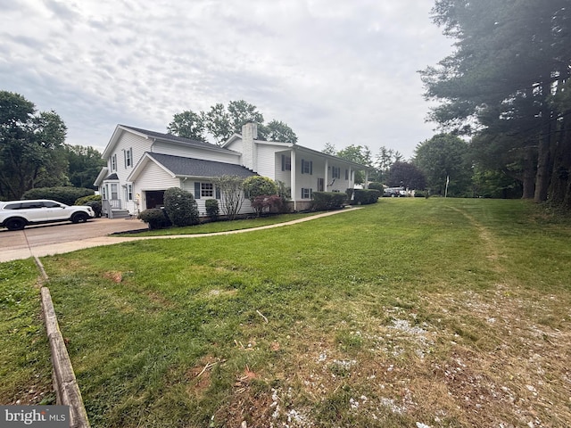 6802 Grays Mill Rd, Warrenton, VA 20187 - view of side of property featuring a chimney, concrete driveway, a yard, and a garage