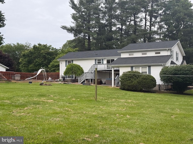 6802 Grays Mill Rd, Warrenton, VA 20187 - back of property with stairway, a wooden deck, a shingled roof, and a yard