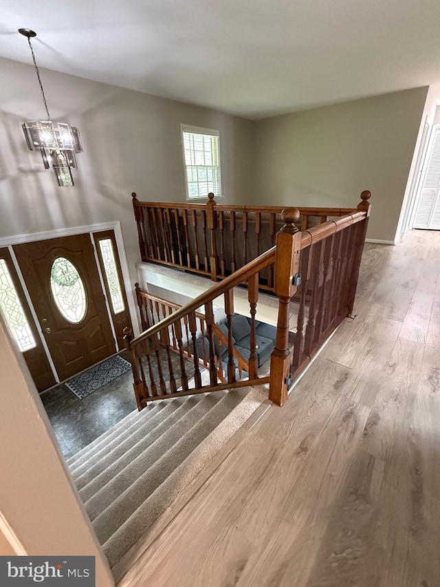 6802 Grays Mill Rd, Warrenton, VA 20187 - entrance foyer with wood finished floors, a chandelier, and baseboards