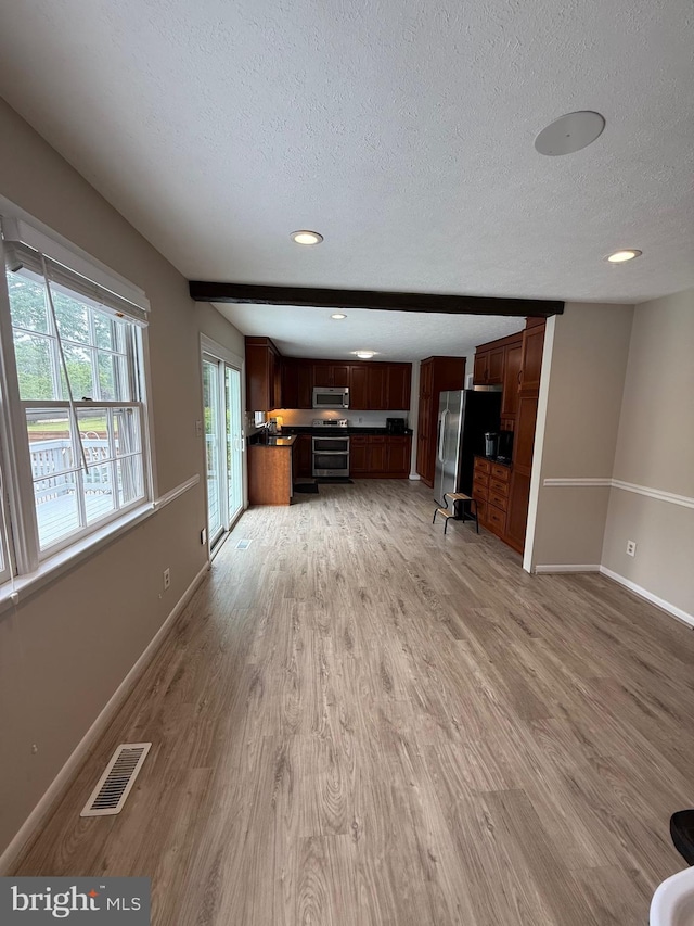 6802 Grays Mill Rd, Warrenton, VA 20187 - unfurnished living room with a textured ceiling, light wood finished floors, baseboards, and recessed lighting