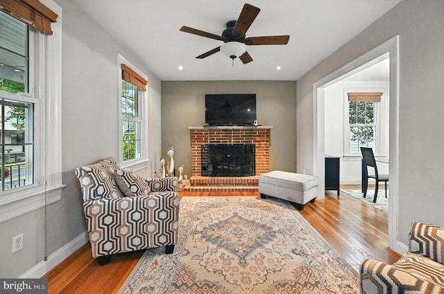 3921 22nd St NE, Washington, DC 20018 - living area with wood finished floors, ceiling fan, a fireplace, and recessed lighting