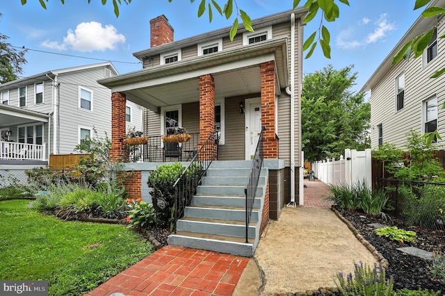 3921 22nd St NE, Washington, DC 20018 - view of front of house with a porch and a chimney