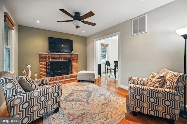 3921 22nd St NE, Washington, DC 20018 - living room with ceiling fan, wood finished floors, recessed lighting, and a fireplace