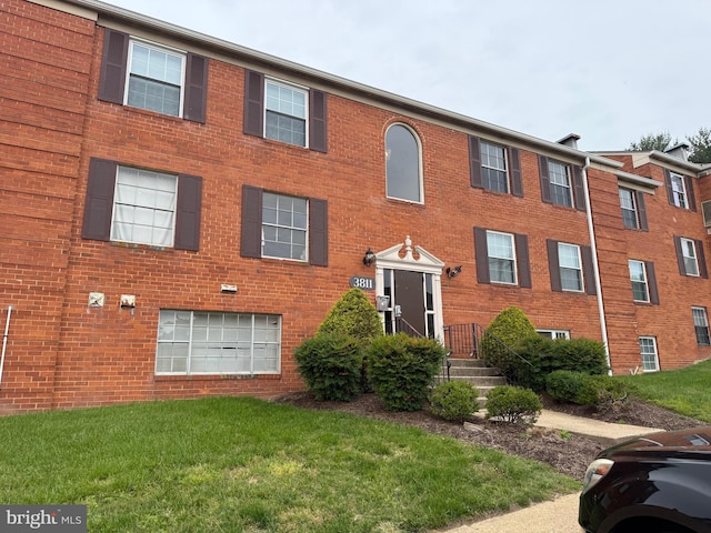 3811 Swann Rd Unit T-3, Suitland, MD 20746 - view of front of house featuring a front yard and brick siding