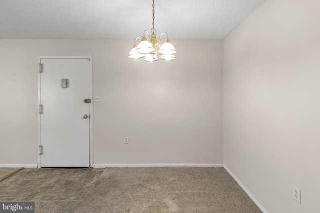 3811 Swann Rd Unit T-3, Suitland, MD 20746 - carpeted empty room with a chandelier, baseboards, and a textured ceiling