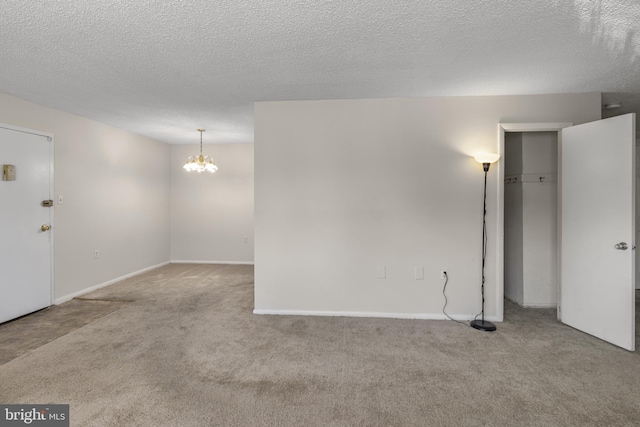 3811 Swann Rd Unit T-3, Suitland, MD 20746 - carpeted spare room featuring a chandelier, a textured ceiling, and baseboards