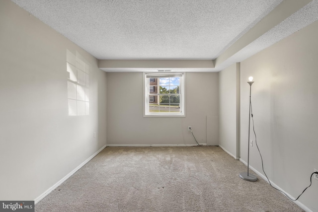 3811 Swann Rd Unit T-3, Suitland, MD 20746 - carpeted empty room with a textured ceiling and baseboards