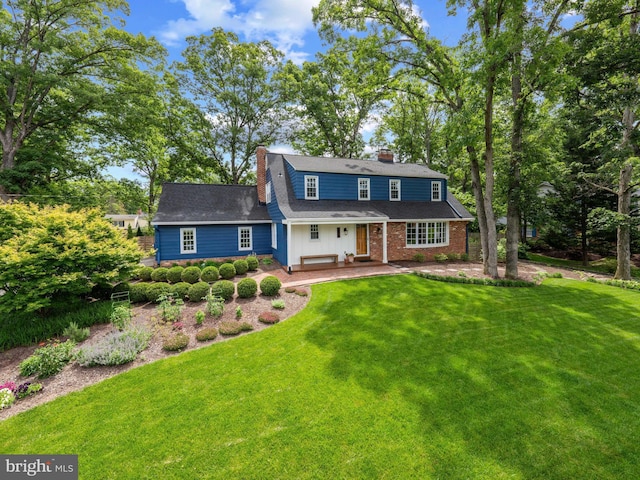 9103 Chickawane Ct, Alexandria, VA 22309 - view of front facade featuring a chimney and a front yard